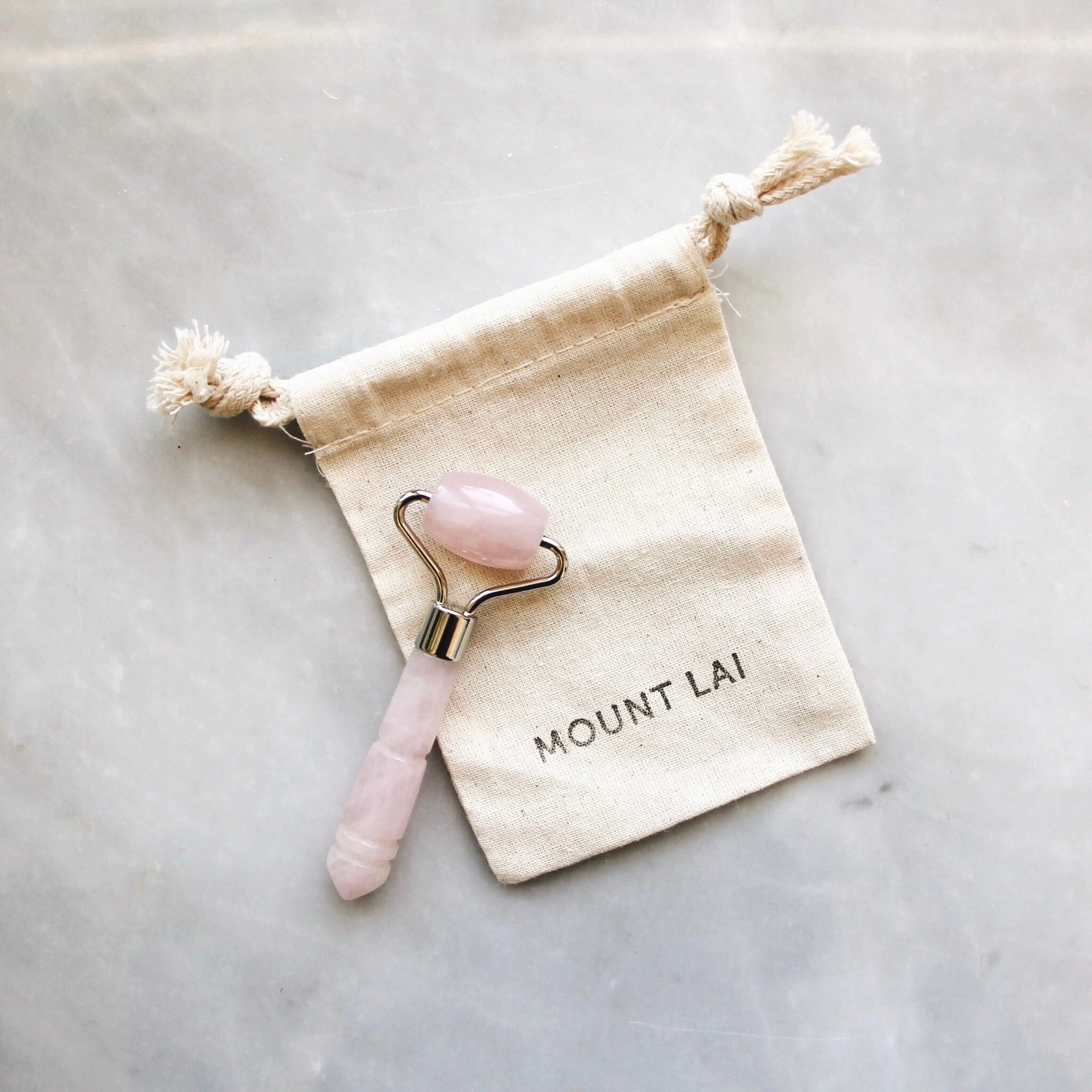The De-Puffing Mini Rose Quartz Facial Roller